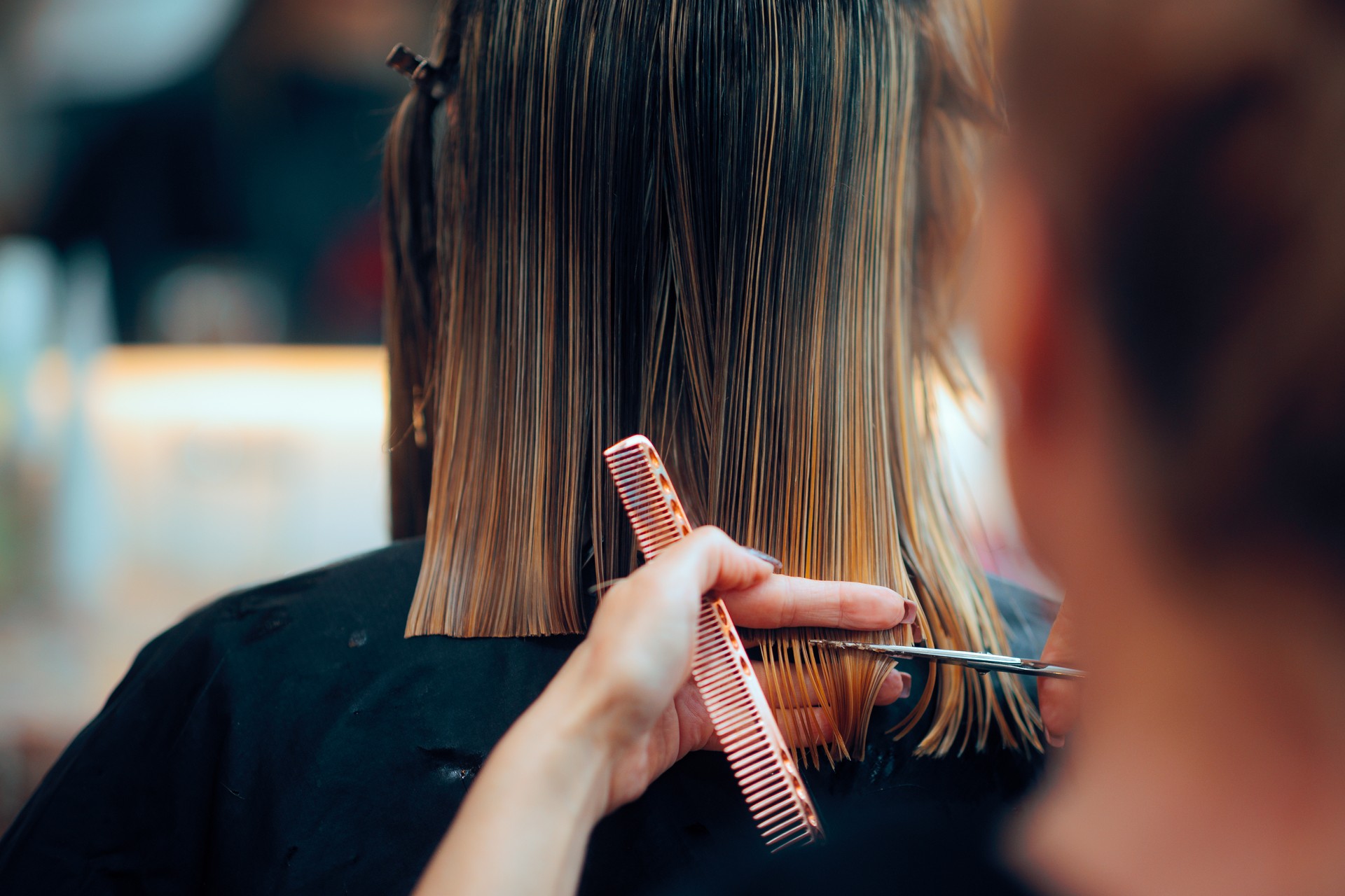 Hairstylist Cutting on Wet Hair with Professionalism and Precision